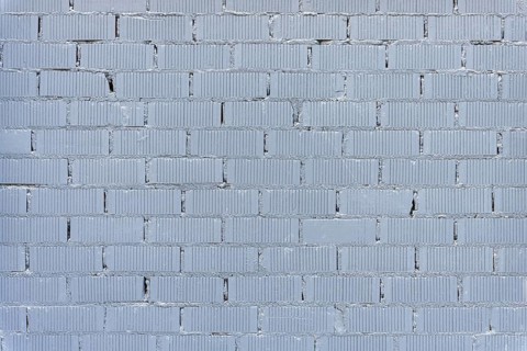 Background consisting of a wall of grey painted bricks