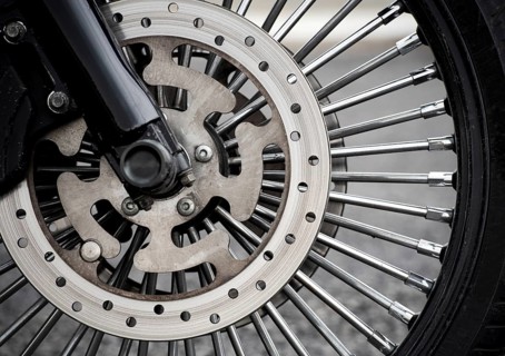 Motorbike front wheel close-up, outdoor on street. bike riding. Close up front wheel of a