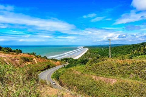 Road along the coast of the state of Bahia next to the beaches of Pe de Serra and Sargi in Serra