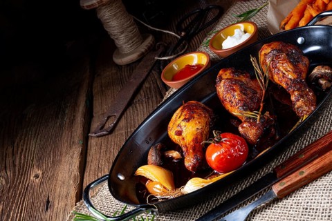 Grilled chicken legs in a barbecue marinade with sweet potatoes