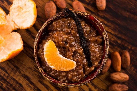 A bowl of chocolate tapioca pudding with fruits