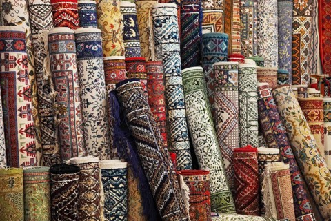 Many colorful carpets in the store. Background