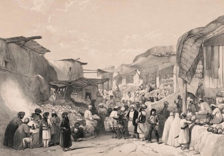 Afghans in a marketplace buying and selling fruit, Main street in the bazaar at Kabul, Afghanistan,