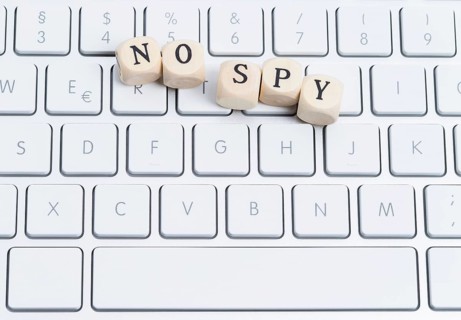 The photo shows a keyboard with wooden letters with the words