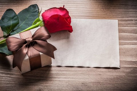 Red rosebud present box blank sheet of paper holiday concept