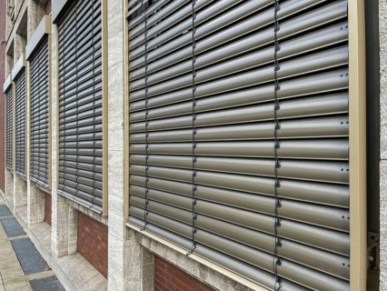 Windows with lowered shutters