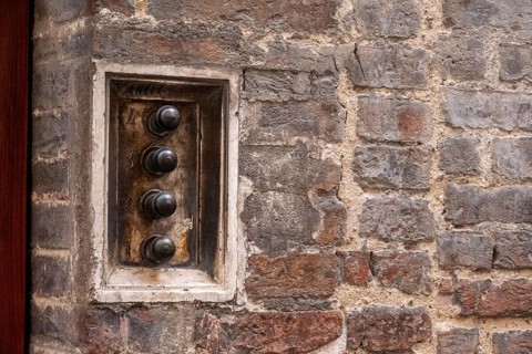 An old antique doorbell of a Sienese residential house, Italy