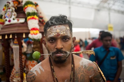 31/01/2018, Singapore, Republic of Singapore, Asia, A devout Hindu man's cheeks are pierced with a