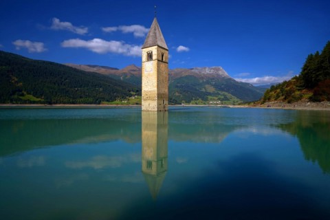 Lake Recshensee with church tower in South Tyrol, Lake Reschen, South Tyrol, Italy