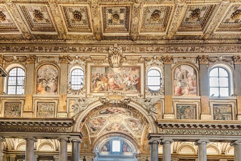 Coffered ceiling of the right aisle with a view into the domed chapel of the capella sistina of the