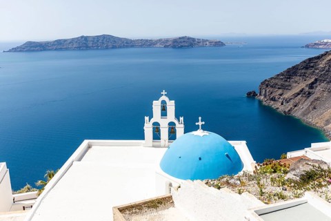 Blue church dome, bell tower, view of the caldera, Thirassia Island, Santorini, Cyclades, Greece