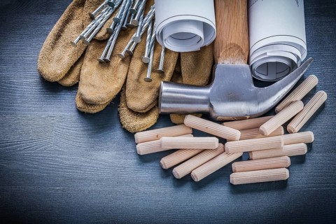 Dowels hammer blueprints nails gloves
