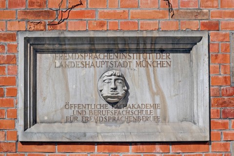 Information sign with Janus head, Foreign Language Institute of the state capital in Amalienstraße,