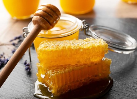 Honeycomb on slate tray on kitchen table closeup, food photography, food photography