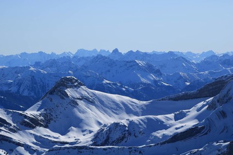Snow covered mountain Ranges in the Swiss and Austrian Alps seen from Chaeserrugg