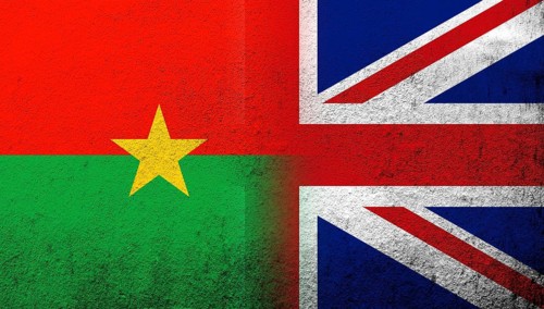 National flag of United Kingdom (Great Britain) Union Jack with National flag of Burkina Faso.