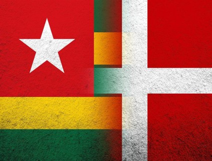 The Kingdom of Denmark National flag with The Togolese Republic Togo National flag. Grunge