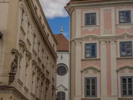 Historic buildings with ornate facades in a narrow alleyway in the historic town centre, Dürnstein,