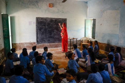 Teacher teaching students in school class room, Jaisalmer, Rajasthan, India, Asia