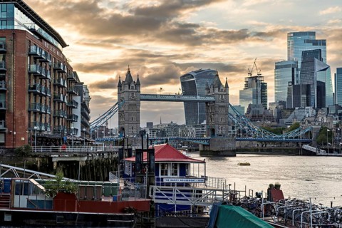 View over the Thames with Tower Bridge and the skyline in the evening light, London, England, Great