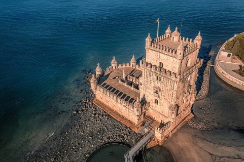 Aerial image of Belem tower, Lisbon, Portugal at summer day. Medieval fortification on Tagus river