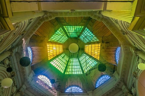Macca Villacrosse Passage, a fork-shaped, yellow glass covered arcaded street in central Bucharest,