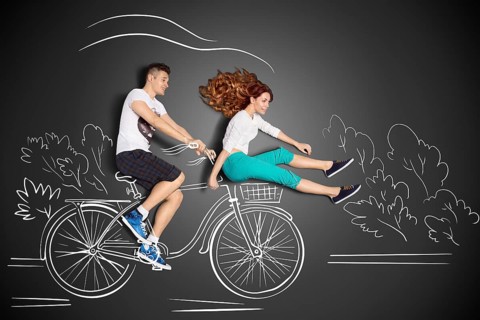 Happy valentines love story concept of a romantic couple against chalk drawings background. Male