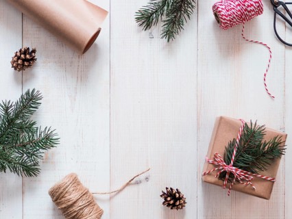 Christmas gift wrapping background, copy space for text or design in center. Winter holidays