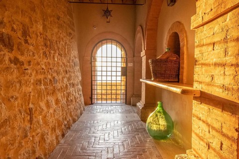 Beautiful sun light inside of an ancient castle near Montalcino, Tuscany, Italy. Old stone medieval