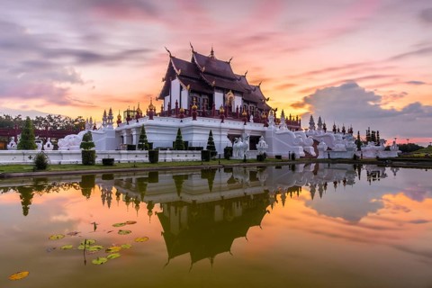 Royal Pavilion and its reflection in pond at Royal Flora Ratchaphruek park. Colorful sky in the