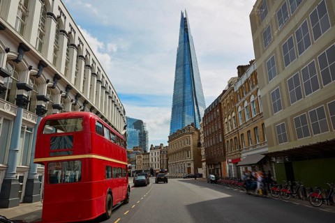 The Shard and old London red Bus in England