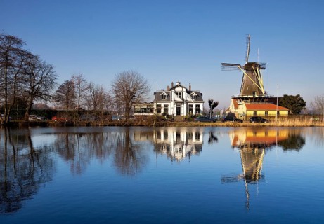 Windmill De Lelie in Rotterdam on the shore of lake Kralingse Plas