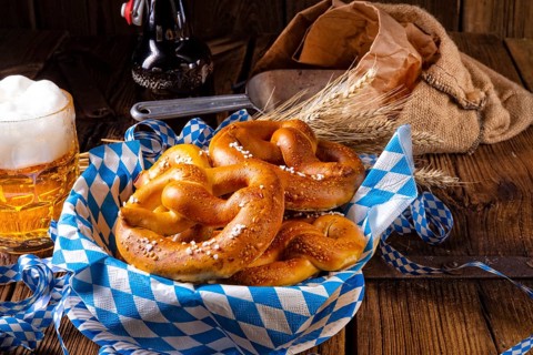 Real homemade bavarian salty pretzel with beer