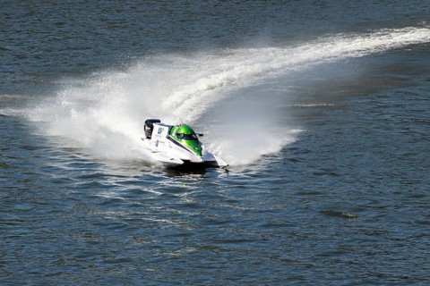 PESO DA REGUA, PORTUGAL - SEPTEMBER 15, 2024: White Powerboat Makes Turn with Splashes of Water