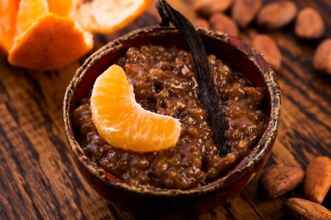 A bowl of chocolate tapioca pudding with fruits