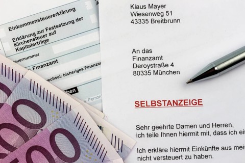 Symbolic photo for a voluntary disclosure for tax evasion at the tax office in Germany Austria