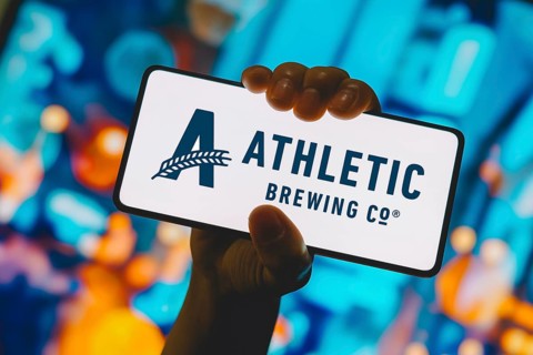 In this photo illustration, the Athletic Brewing Company logo is displayed on a smartphone screen