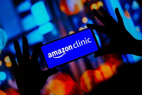 In this photo illustration, the Amazon Clinic logo seen displayed on a smartphone