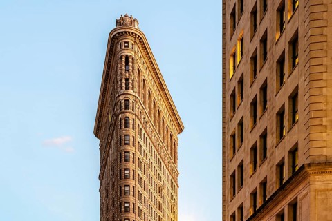 Low angle view of Flatiron Building in Manhattan against blue sky