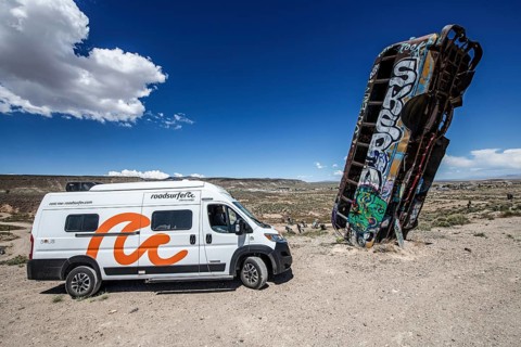 Motorhome and scrap cars decorated with graffiti in the Carforest of Goldfield, Nevada, USA