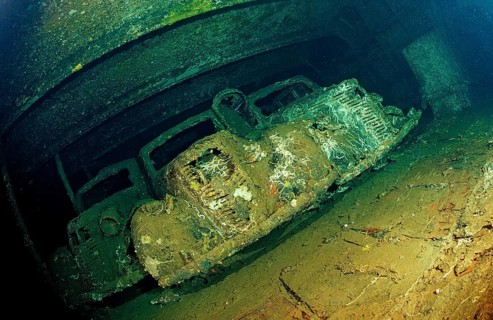 Diver in shipwreck Umbria, military vehicles, Sudan, Africa, Red Sea, Wingate Reef