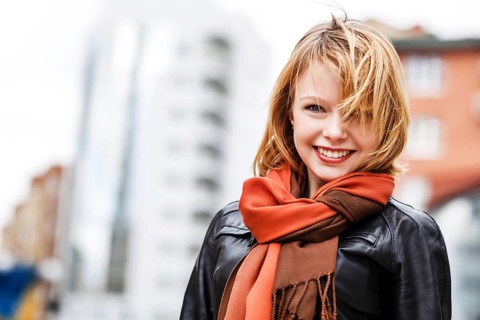 Street portrait of young beautiful fashionable woman. Street fashion concept
