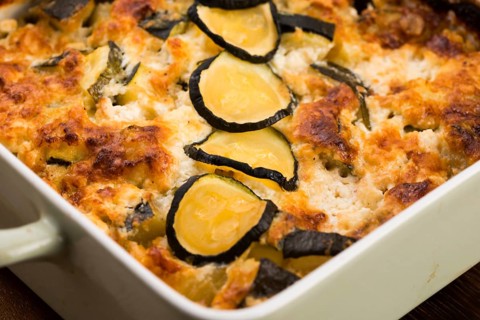 Casserole with cheese and courgette in baking dish
