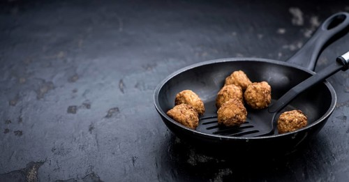Slate slab with homemade Meatballs (selective focus, close-up shot)