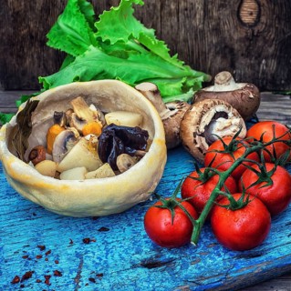 Vegetable hot plate made of baked dough cooked in a rustic style.Photo tinted