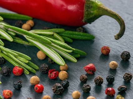 Herbs and spices over slate background. Top view or flat lay. Food background