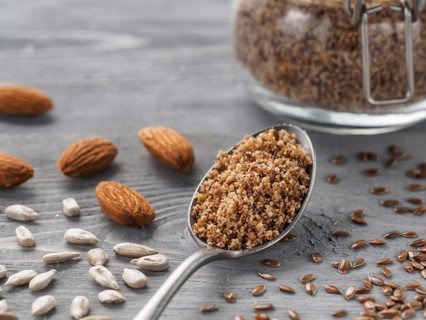 Homemade LSA mix in spoon - Linseed or flax seeds, Sunflower seeds and Almonds. Traditional
