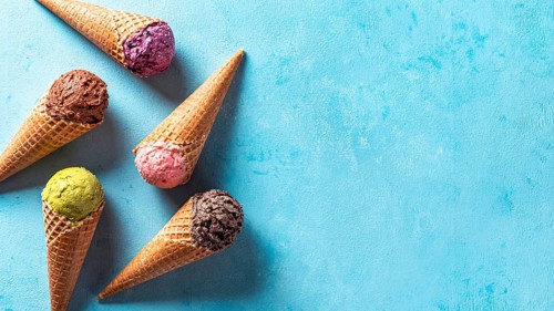 Various ice cream scoops in cones with copy space. Colorful ice cream in cones chocolate,