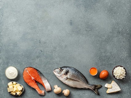 Vaitamin D sources concept with copy space for text. Fish, salmon, dairy products, eggs, mushrooms
