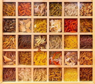 30 types of Italian pasta collection. Various colors of pasta viewed from above. Top view